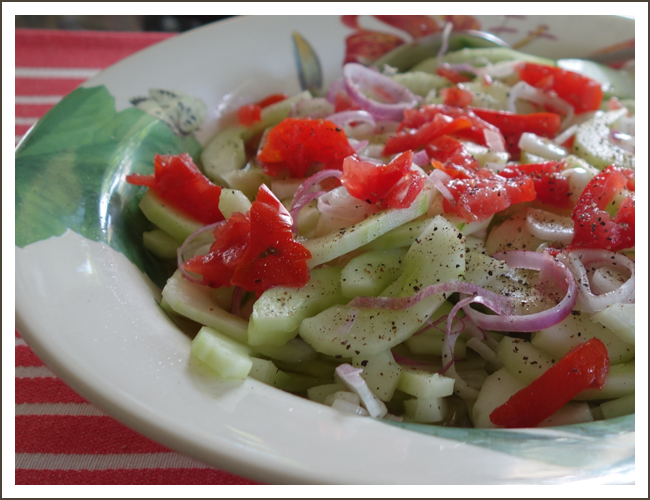 Cucumbers and onions in vinegar dressing