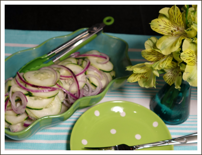 Cucumbers and onions in vinegar dressing