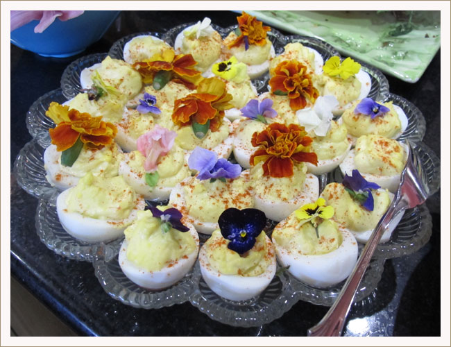 Deviled eggs with edible flowers